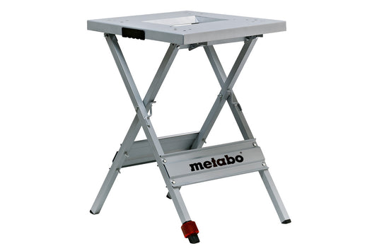 Soporte de trabajo Metabo, plegable con compensacion de altura, utilizable en superficies irregulares. Dimensiones de mesa 570 x 600 mm, Ref. 631317000